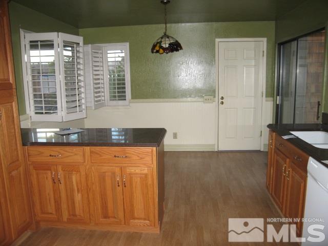 682 West Riverview Circle Reno, NV 89509 - Photo 9 of 11 a bathroom with a granite countertop sink a mirror and a shower