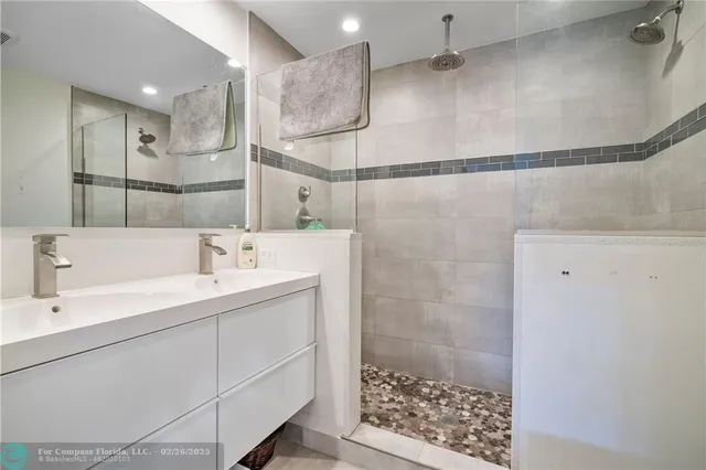 a bathroom with a sink and a shower