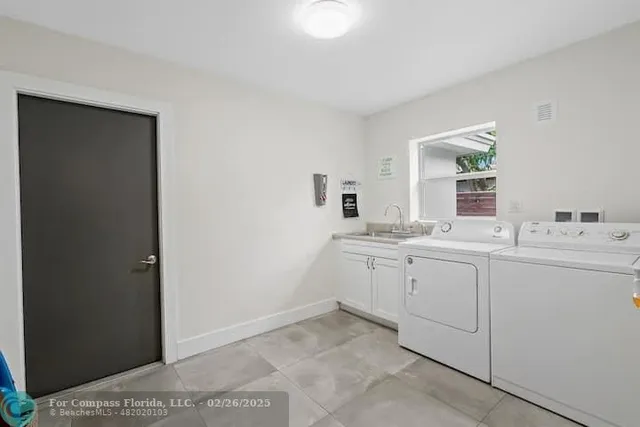 a bathroom with a sink vanity and mirror