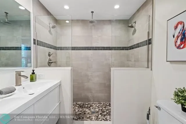 a bathroom with a sink and a shower