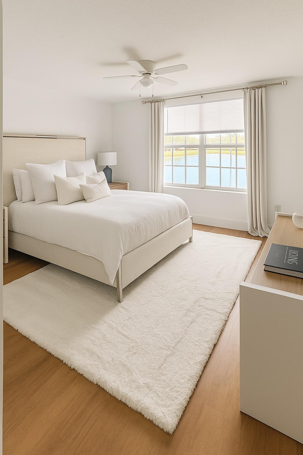 15135 Michelangelo Boulevard, Unit 108 Delray Beach, FL 33446 - Photo 7 of 17 a bedroom with a bed and a large window