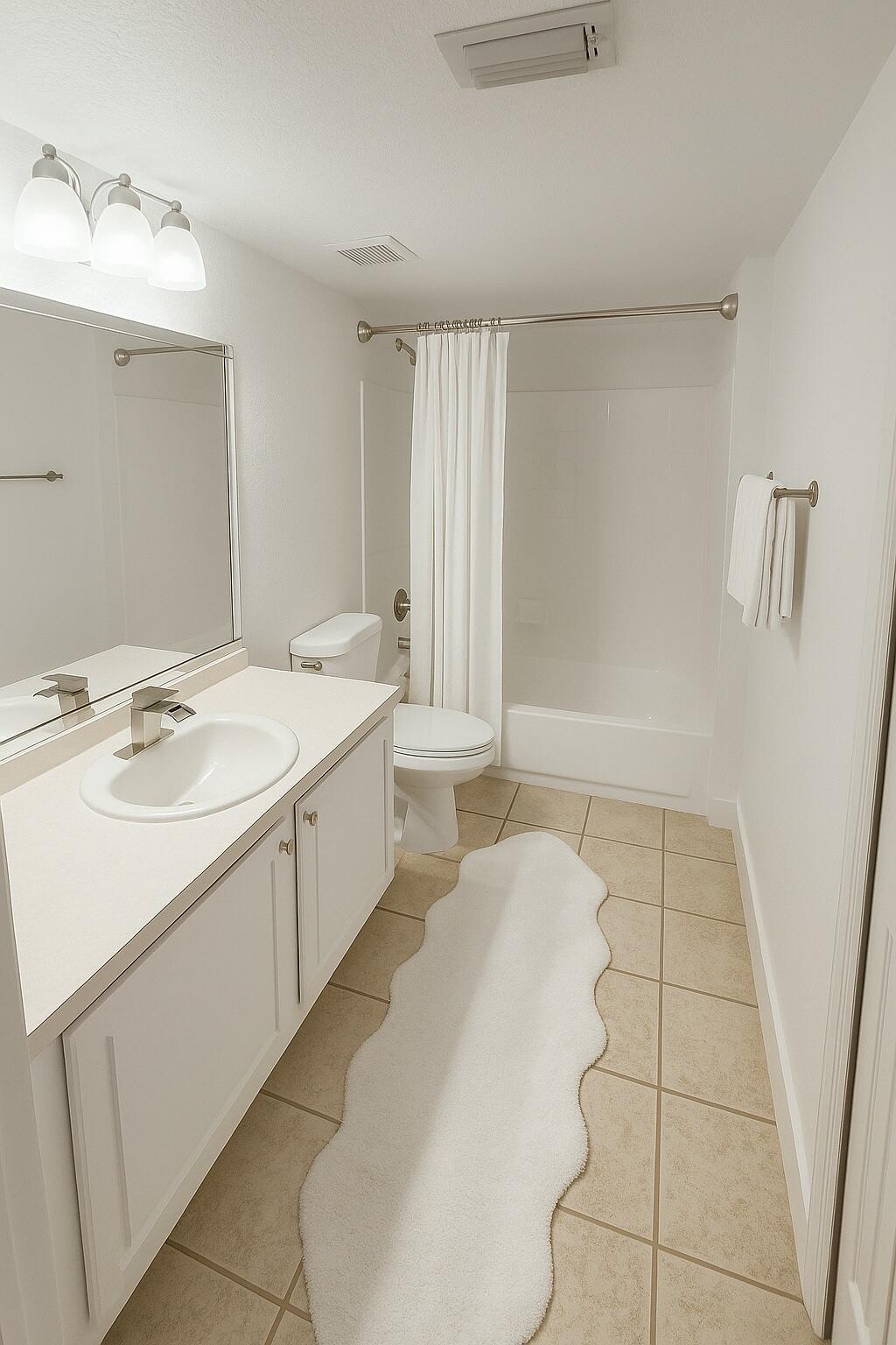 15135 Michelangelo Boulevard, Unit 108 Delray Beach, FL 33446 - Photo 9 of 17 a bathroom with a sink a toilet and mirror