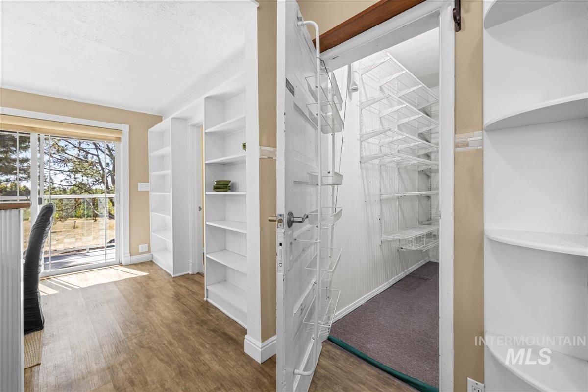 5611 West Hill Road Boise, ID 83703 - Photo 13 of 48 Interior space with wood finished floors and a textured ceiling