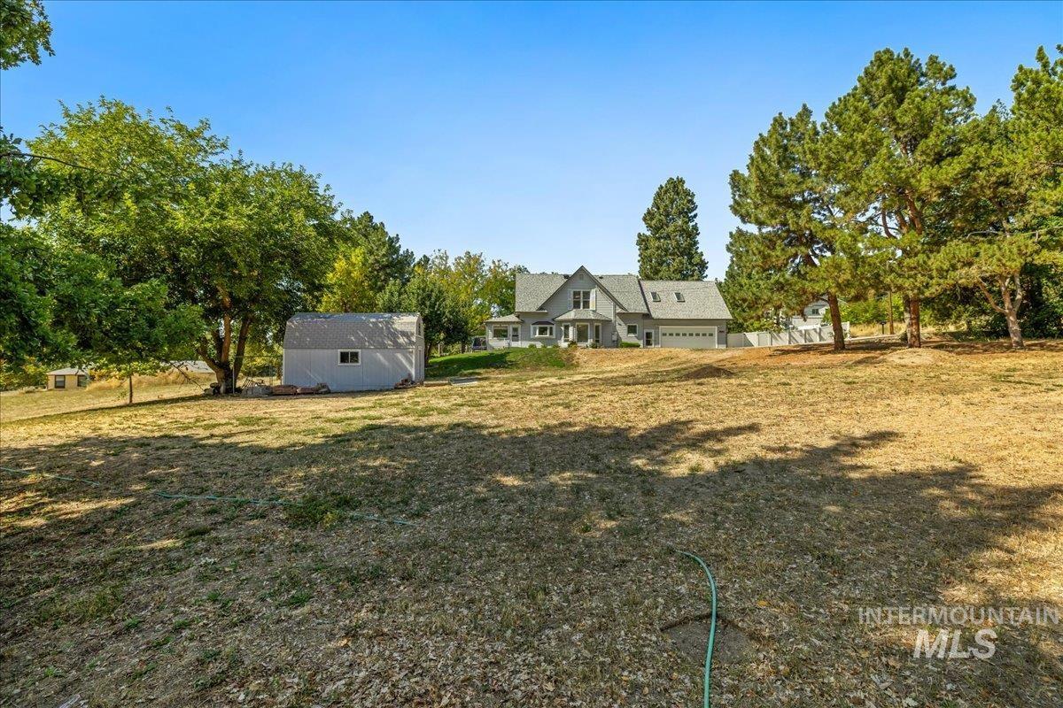 5611 West Hill Road Boise, ID 83703 - Photo 36 of 48 View of grassy yard featuring an outdoor structure