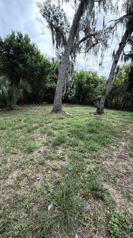 a view of outdoor space with deck and yard