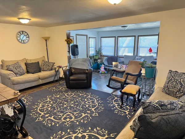 a living room with furniture and a rug