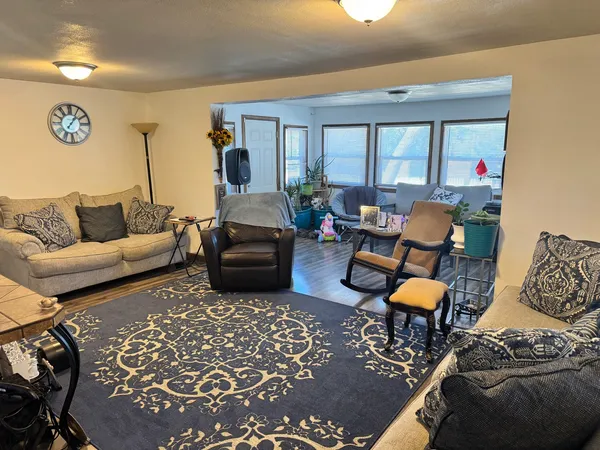 a living room with furniture and a rug