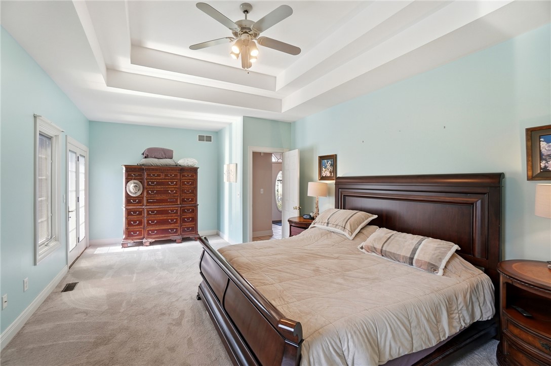 472 Timber Walk Court Springboro, OH 45066 - Photo 21 of 86 This peaceful primary suite features a tray ceiling and plush carpet for ultimate comfort.