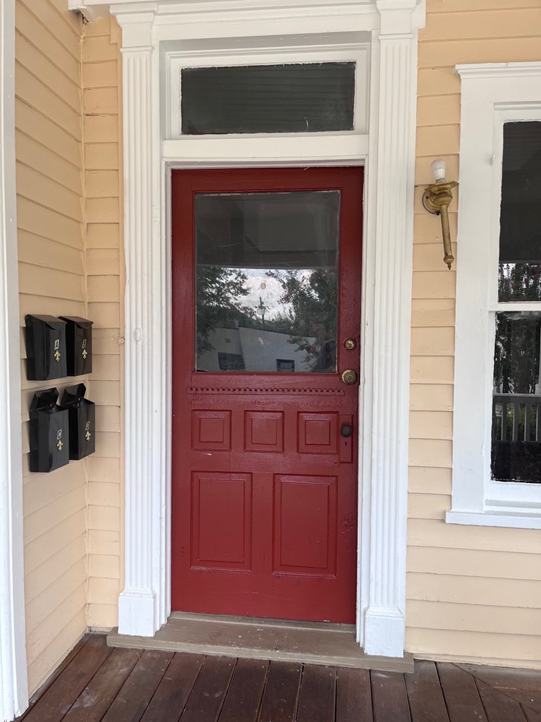 1231 18th Street, Unit C Columbus, GA 31901 - Photo 2 of 12 a view of a livingroom with a fireplace and wooden floor