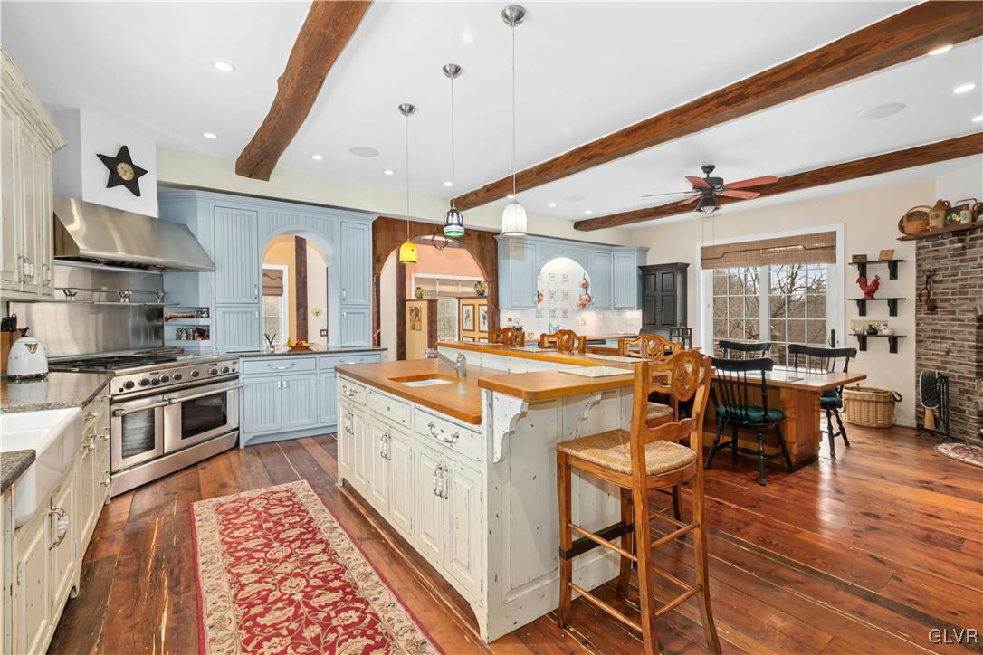 2332 Kunsman Road Quakertown, PA 18951 - Photo 11 of 53 a large kitchen with stainless steel appliances granite countertop a stove and a dining table