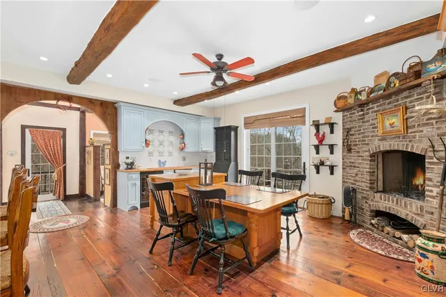a view of a dining room with furniture wooden floor and a chandelier