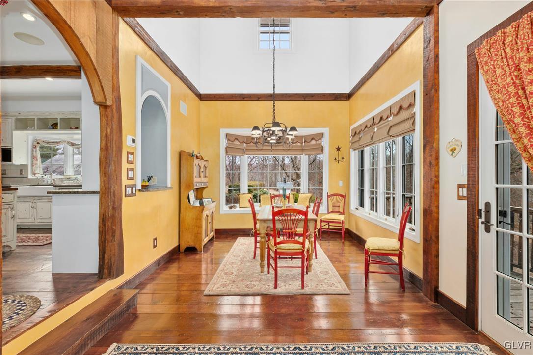 2332 Kunsman Road Quakertown, PA 18951 - Photo 14 of 53 a view of a dining room with furniture wooden floor and a chandelier