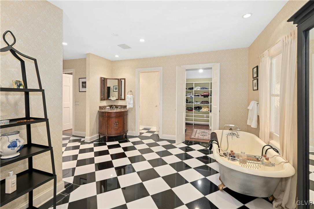 2332 Kunsman Road Quakertown, PA 18951 - Photo 23 of 53 a living room with a black white checkered floor with a gaming machine and dining chairs