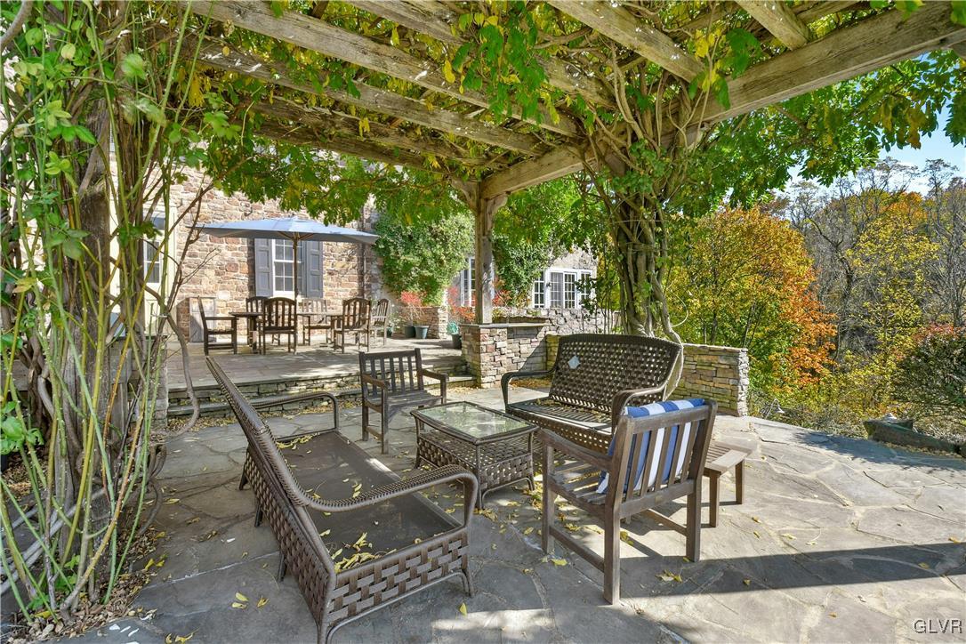 2332 Kunsman Road Quakertown, PA 18951 - Photo 34 of 53 a view of a patio with table and chairs and potted plants