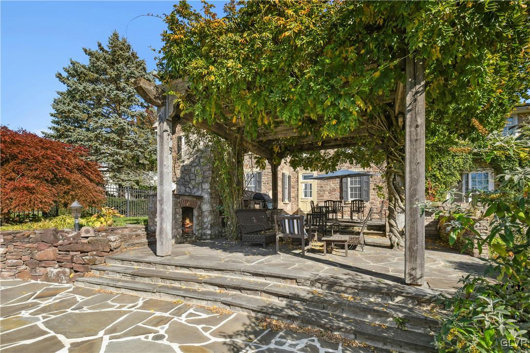 2332 Kunsman Road Quakertown, PA 18951 - Photo 4 of 53 a view of a patio with table and chairs and floor to ceiling window