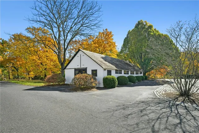 a view of a chair and table in the backyard