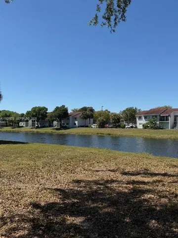 a view of a lake with a city