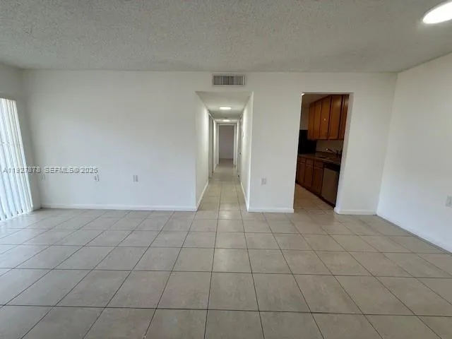 en empty room with a fireplace