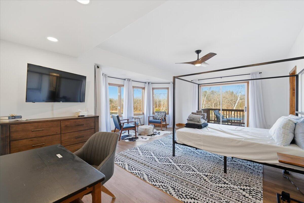 1970 Morewood Road Hardy, VA 24101 - Photo 18 of 61 a living room with furniture floor to ceiling window and a flat screen tv