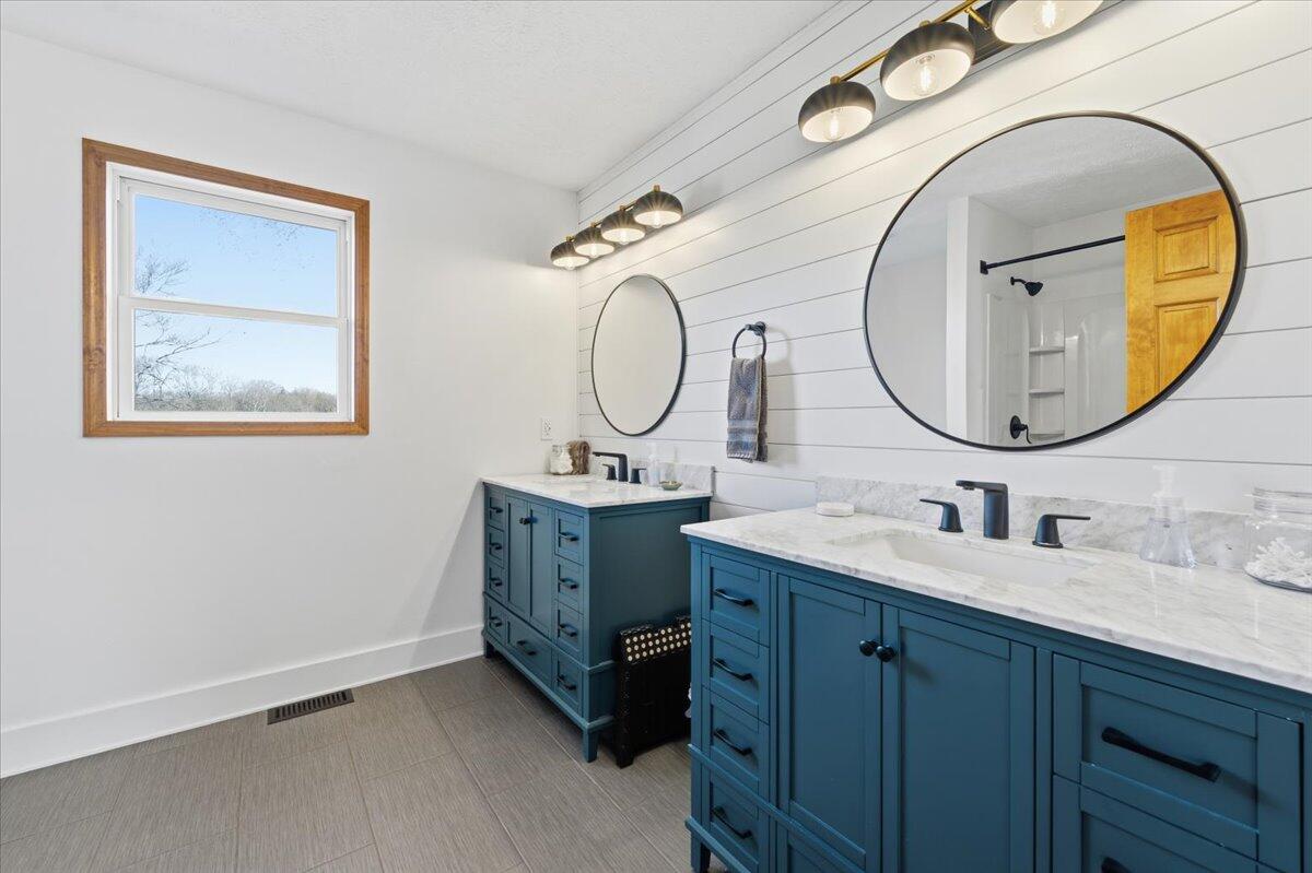 1970 Morewood Road Hardy, VA 24101 - Photo 29 of 61 a bathroom with a double vanity sink and a mirror