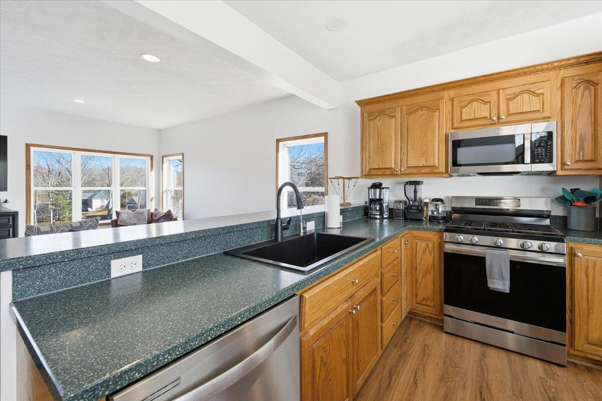 1970 Morewood Road Hardy, VA 24101 - Photo 8 of 61 a kitchen with stainless steel appliances granite countertop a stove a sink and a microwave