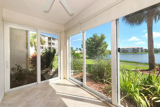 a view of a glass door and front view of a house