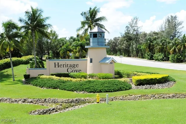 a view of a house with a big yard and potted plants