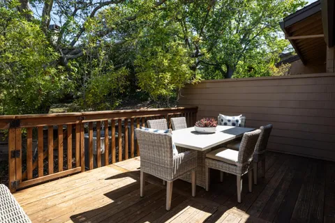 a view of backyard with hardwood and deck