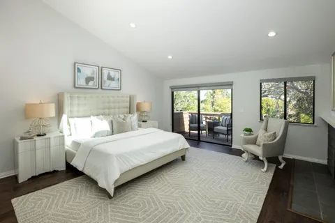 a bedroom with a bed chair and couch