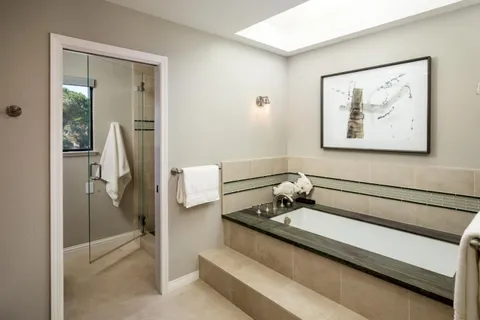 a bathroom with a sink and mirror