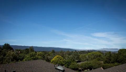 an aerial view of a house with a garden view