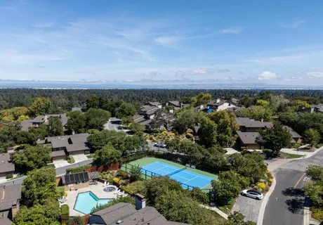 a view of an outdoor space and tennis court