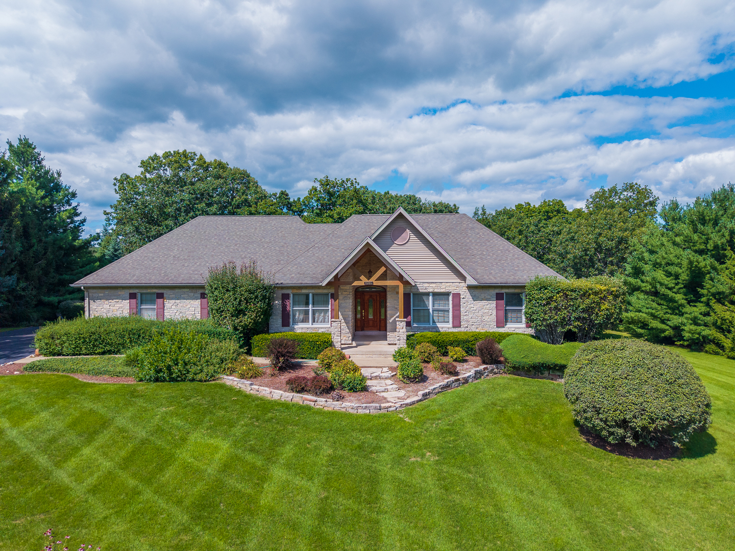 9206 Pine Needle Pass Bull Valley, IL 60097 - Photo 1 of 44 a view of a house with a big yard and potted plants