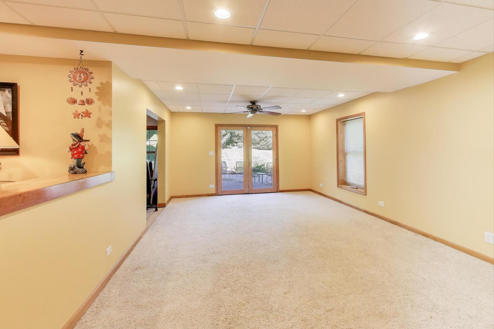 9206 Pine Needle Pass Bull Valley, IL 60097 - Photo 24 of 44 a view of an empty room with a window