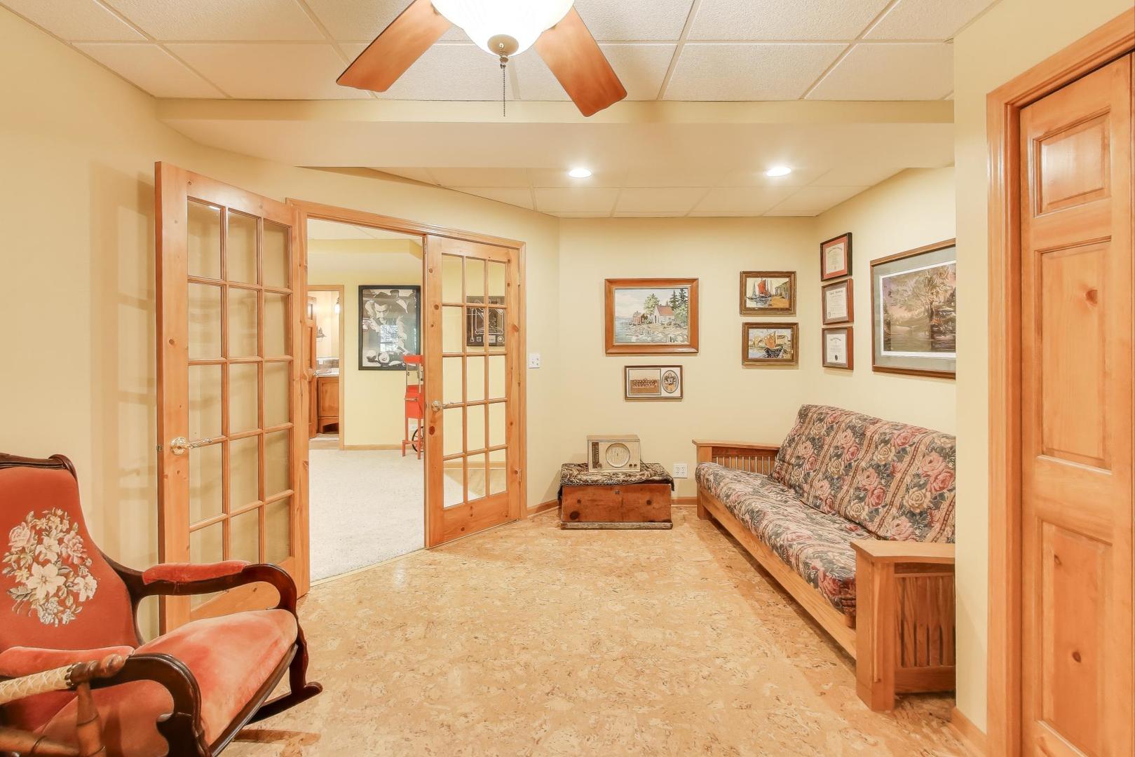 9206 Pine Needle Pass Bull Valley, IL 60097 - Photo 26 of 44 a living room with furniture and a flat screen tv