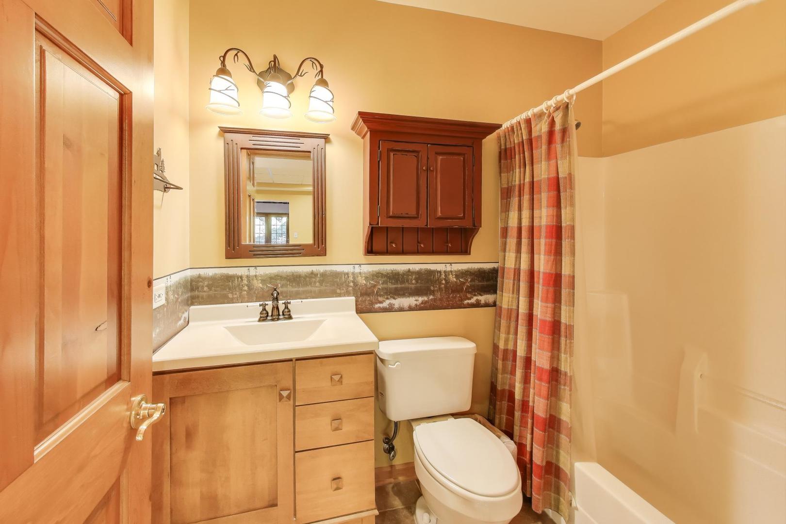 9206 Pine Needle Pass Bull Valley, IL 60097 - Photo 29 of 44 a bathroom with a sink a toilet and a mirror