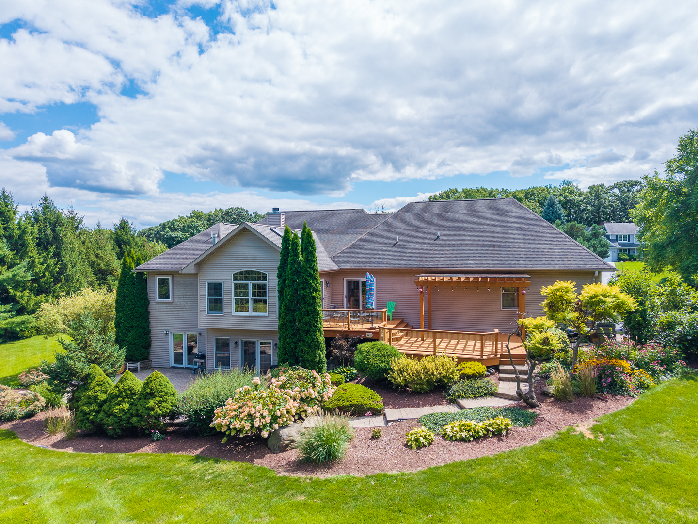 9206 Pine Needle Pass Bull Valley, IL 60097 - Photo 3 of 44 front view of house with yard and trees in the background