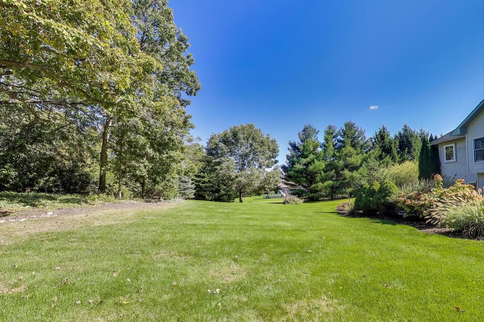 9206 Pine Needle Pass Bull Valley, IL 60097 - Photo 37 of 44 a view of a trees with a big yard