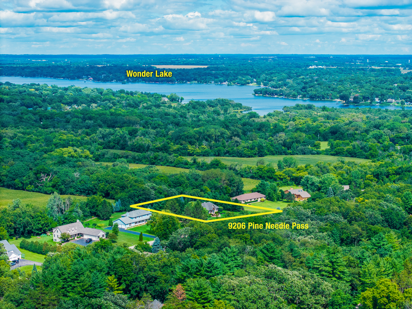 9206 Pine Needle Pass Bull Valley, IL 60097 - Photo 44 of 44 a view of a golf course with a wooden fence
