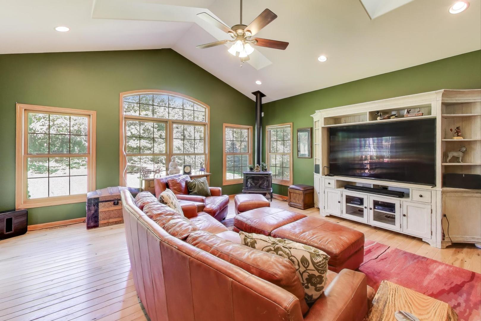 9206 Pine Needle Pass Bull Valley, IL 60097 - Photo 5 of 44 a living room with furniture and a flat screen tv