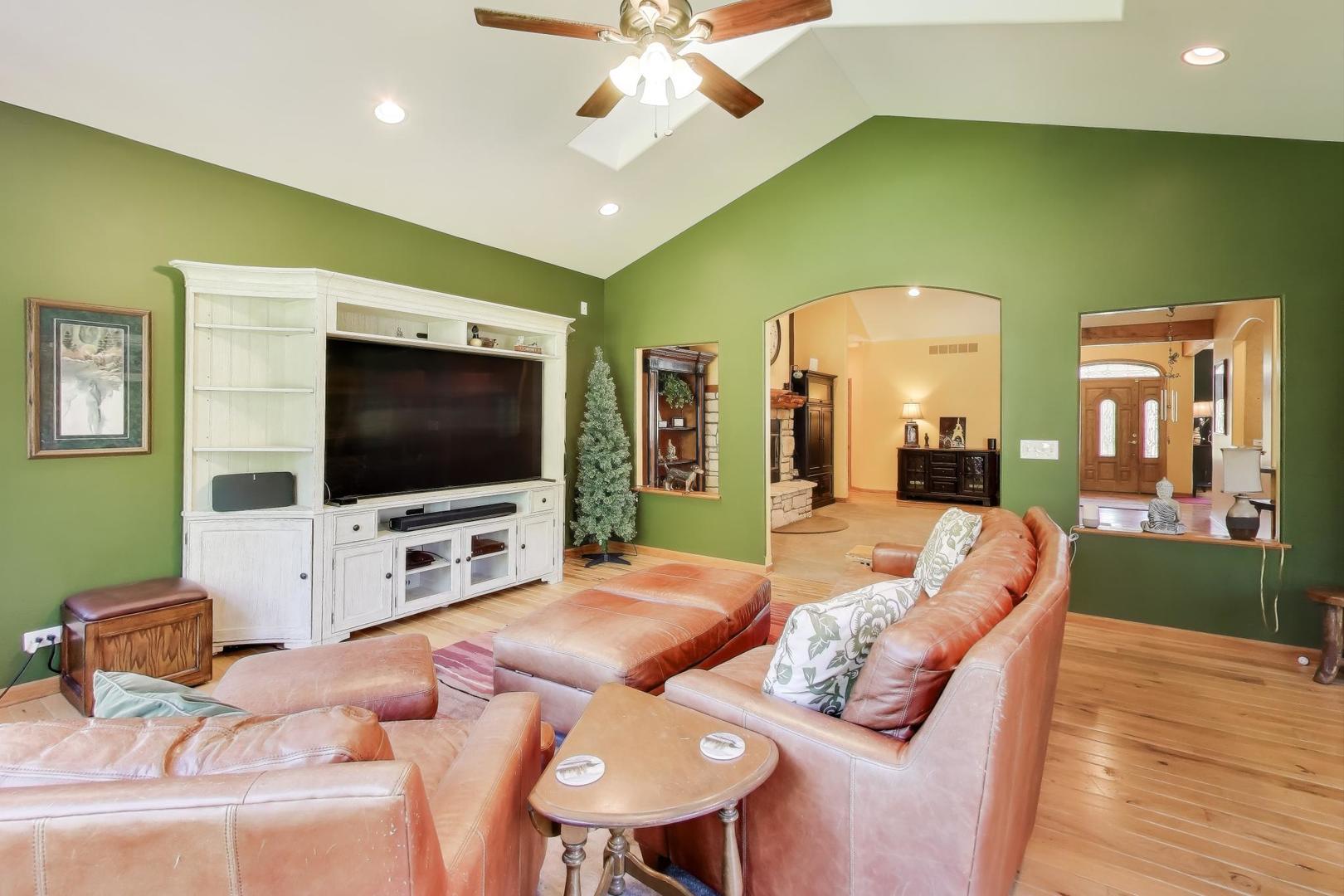 9206 Pine Needle Pass Bull Valley, IL 60097 - Photo 6 of 44 a living room with furniture and a flat screen tv