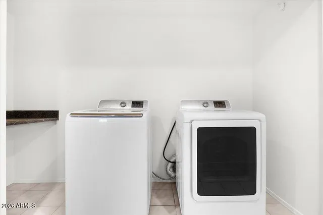 a view of a livingroom with a ceiling fan and window