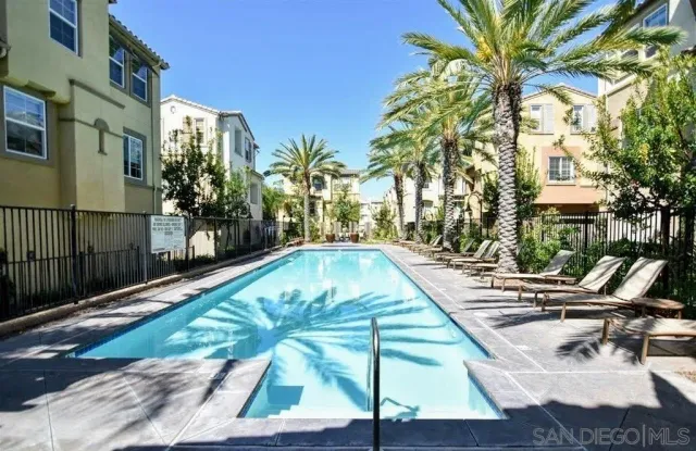 a view of swimming pool with chairs