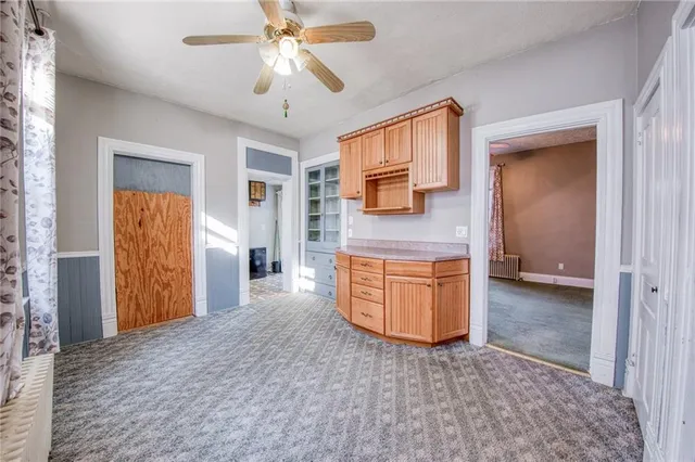 a view of a kitchen with sink and cabinet area