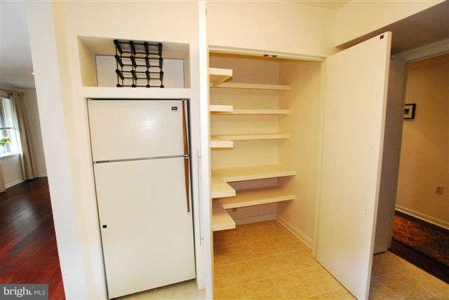120 Cross Keys Road, Unit R120F Baltimore, MD 21210 - Photo 9 of 17 a view of walk in closet with empty racks