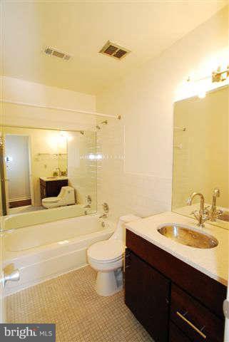 120 Cross Keys Road, Unit R120F Baltimore, MD 21210 - Photo 10 of 17 a bathroom with a sink a toilet and shower