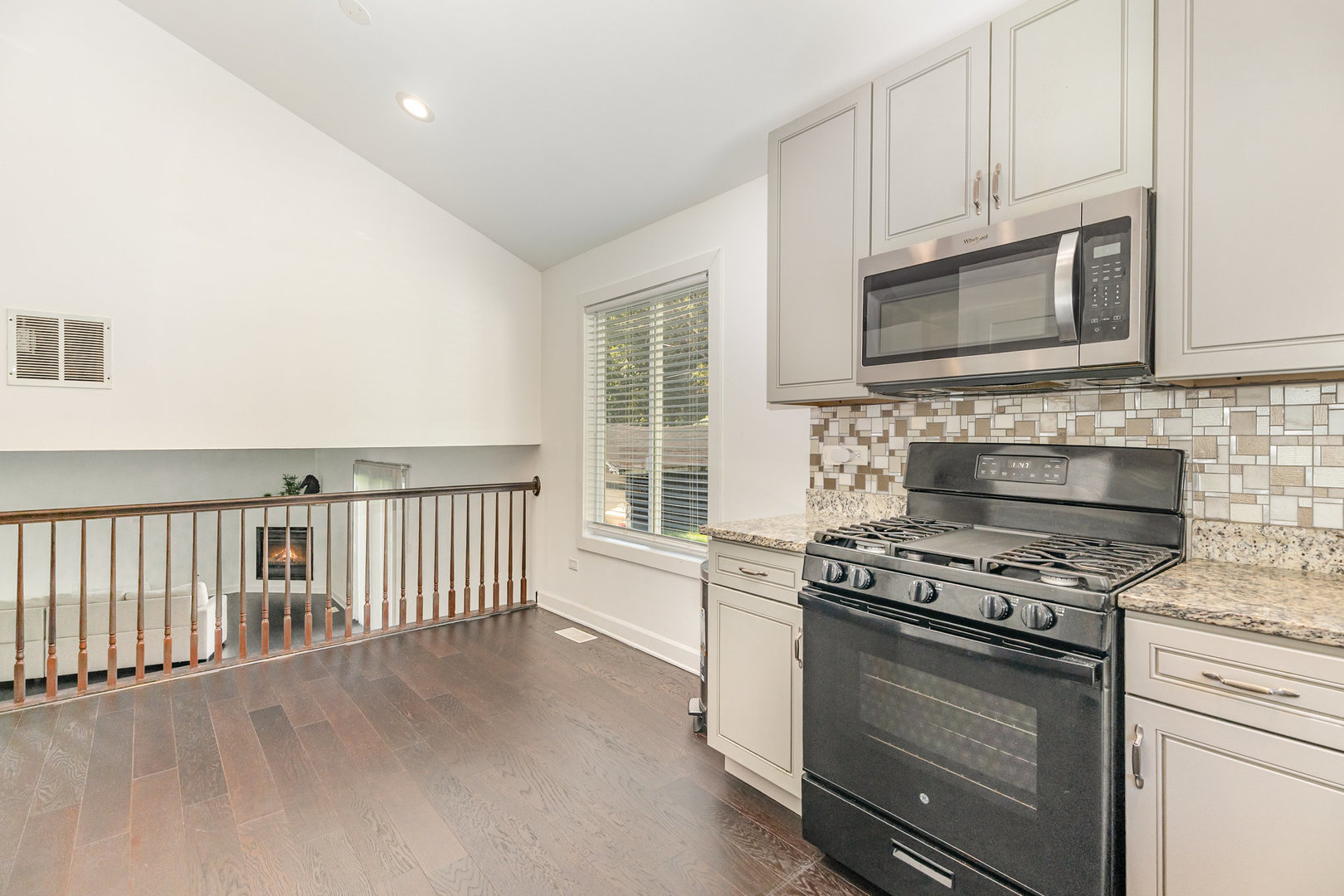 16314 Homan Avenue Markham, IL 60428 - Photo 15 of 32 a kitchen with stainless steel appliances granite countertop white cabinets and window