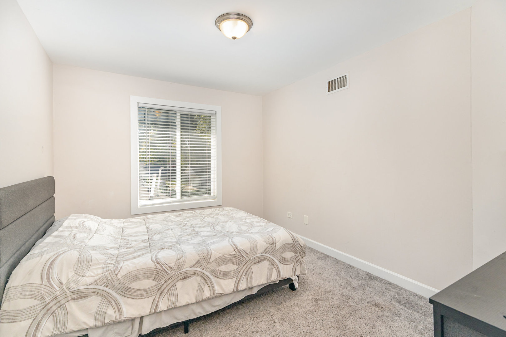 16314 Homan Avenue Markham, IL 60428 - Photo 23 of 32 a bedroom with a bed and a window