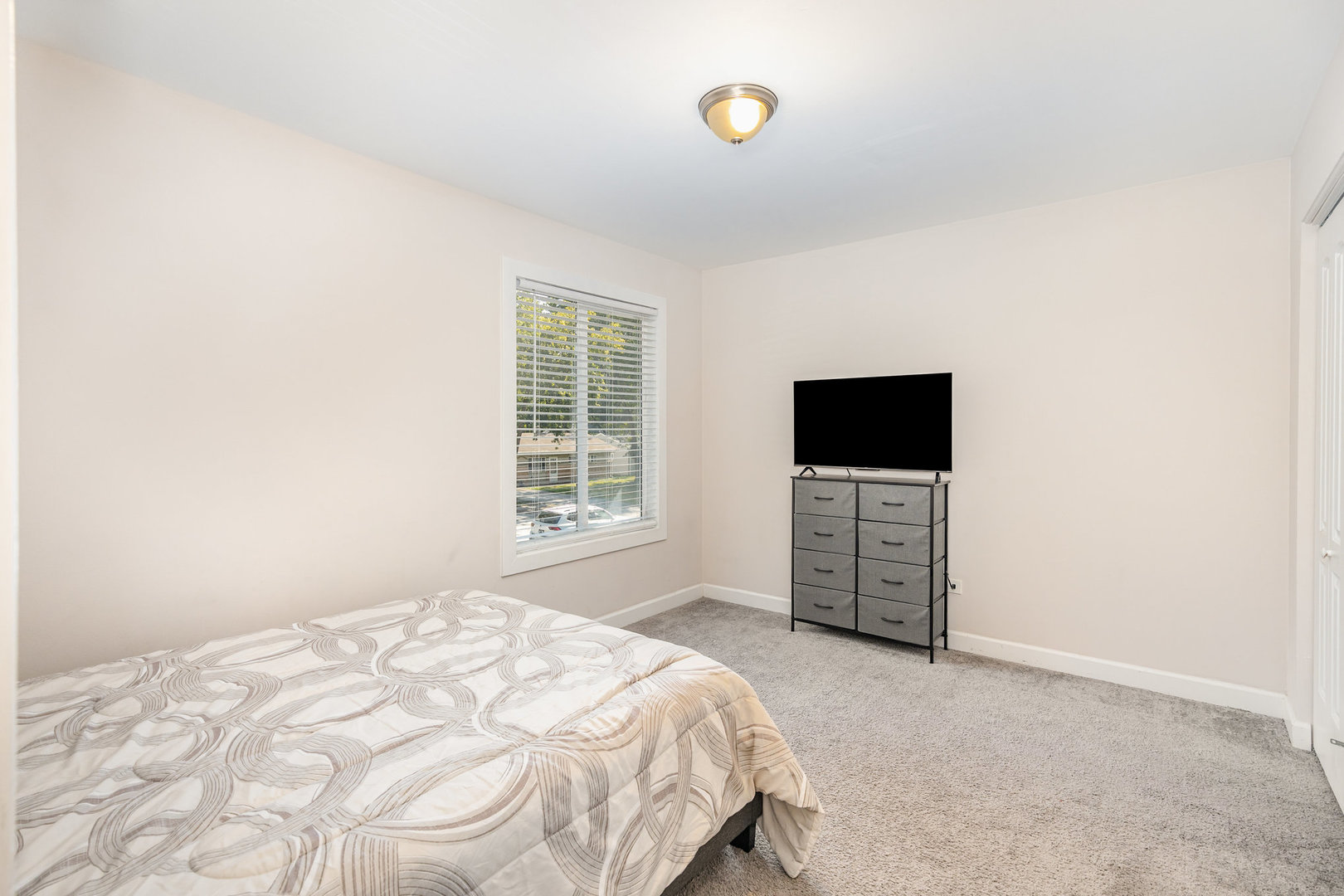 16314 Homan Avenue Markham, IL 60428 - Photo 25 of 32 a bedroom with a bed and a flat screen tv