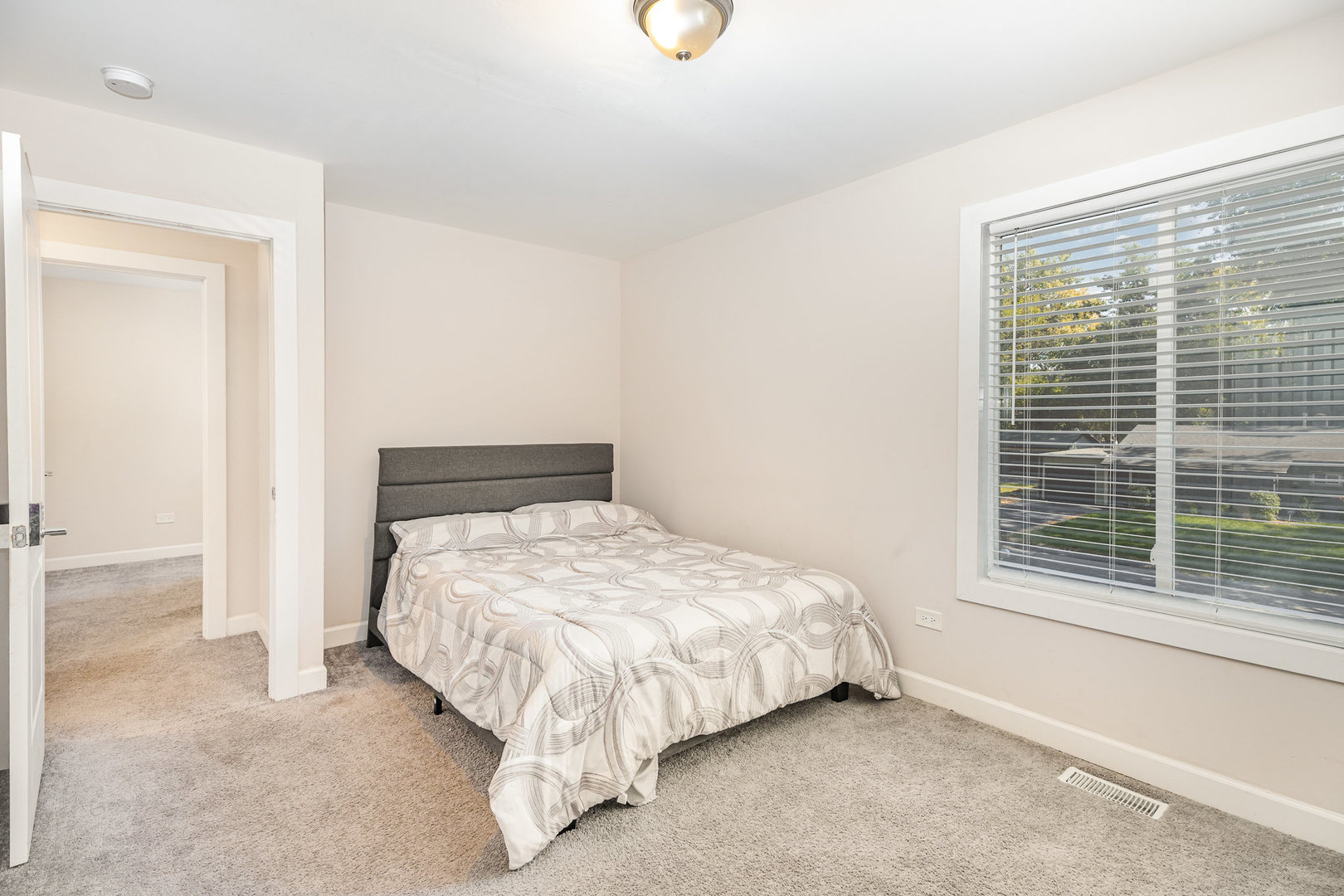 16314 Homan Avenue Markham, IL 60428 - Photo 26 of 32 a bedroom with a bed and window